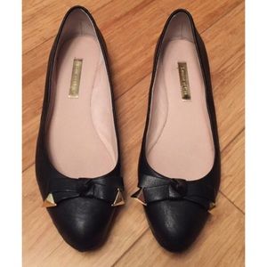 Black and gold ballet flats